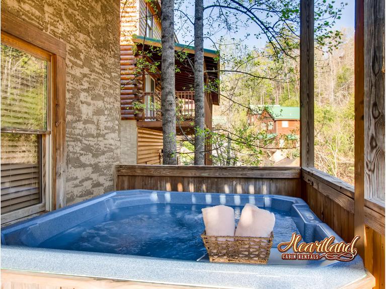 Hot tub outdoors on the lower level of this cabin near Dollywood